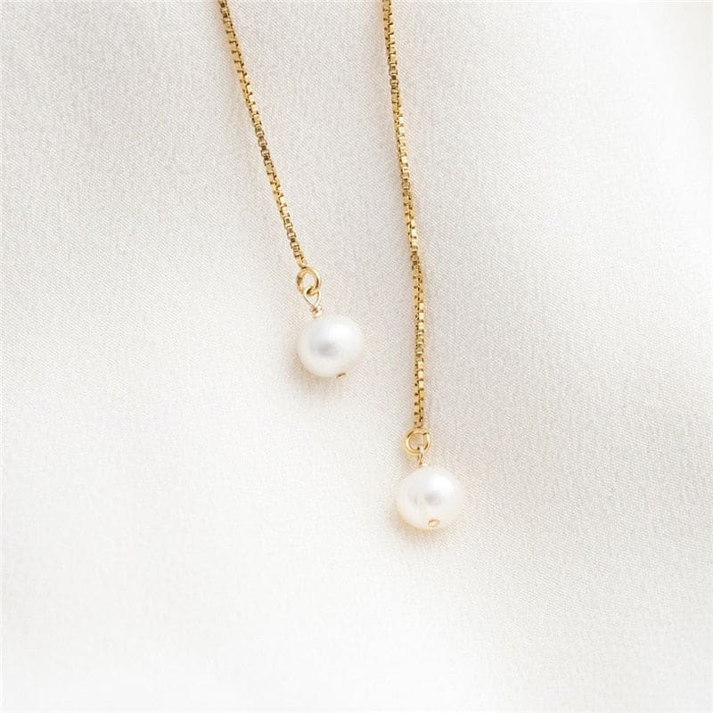 Boucle d&#39;oreille chaine en or avec perle