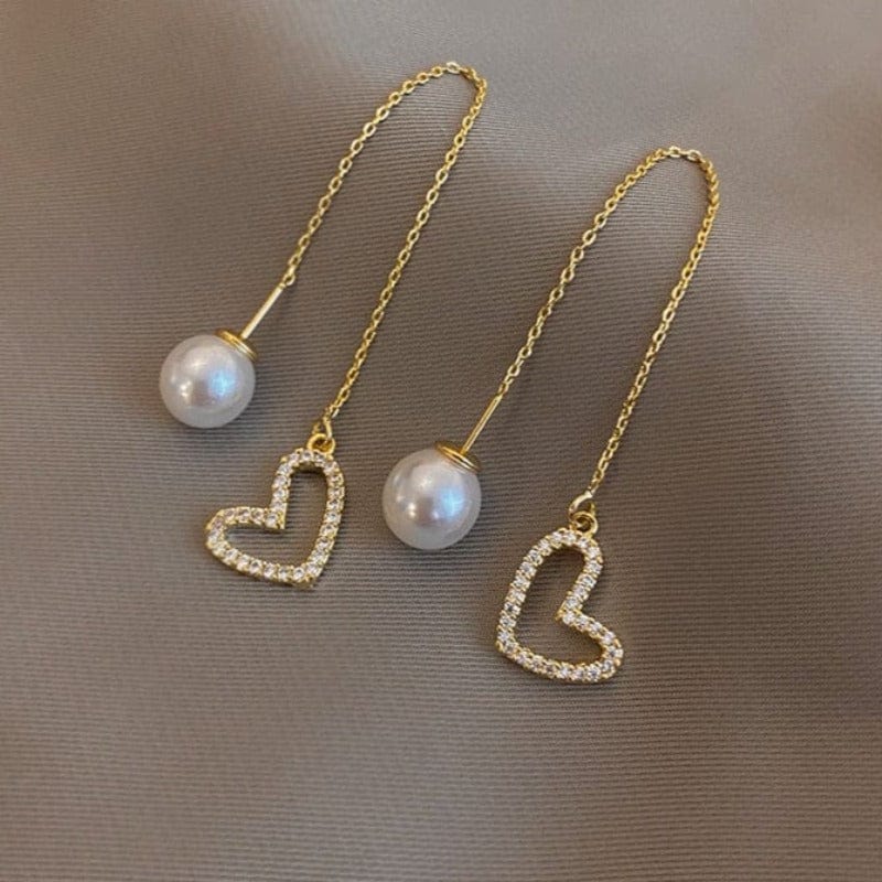 Boucle d&#39;oreille chaine traversante avec coeur