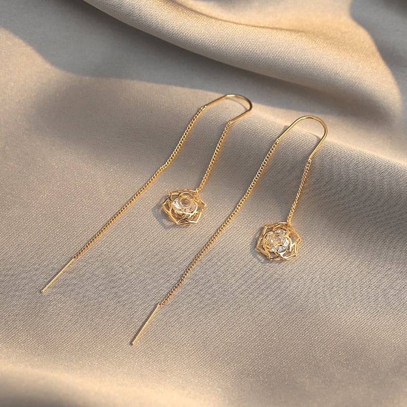 Boucle d&#39;oreille chaine traversante avec rose