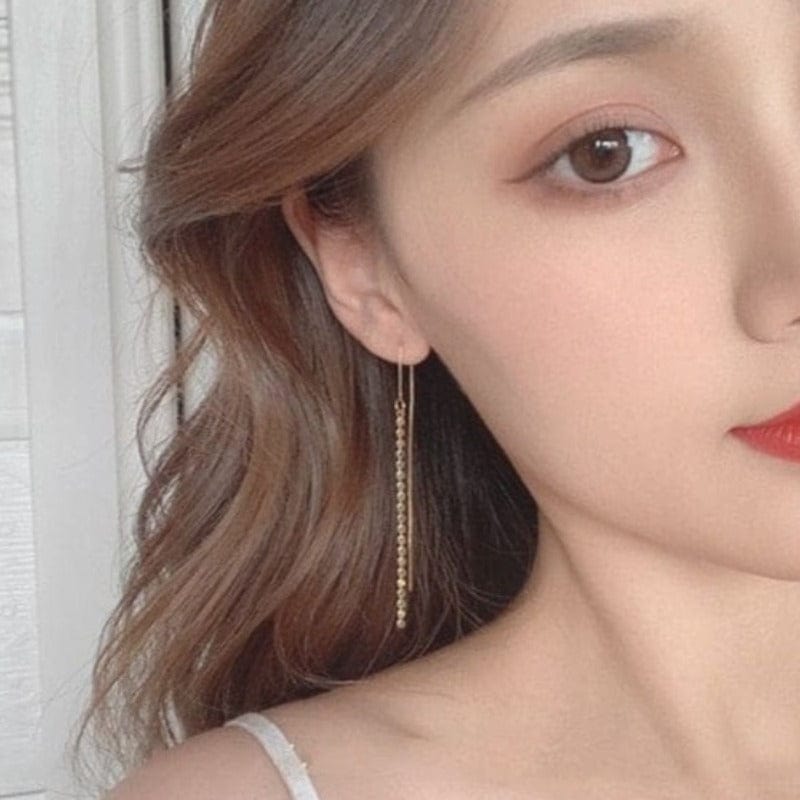 Boucle d'oreille chaine traversante longue