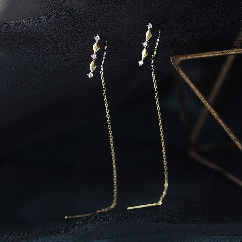 Boucle d&#39;oreille chaine traversante losange doré