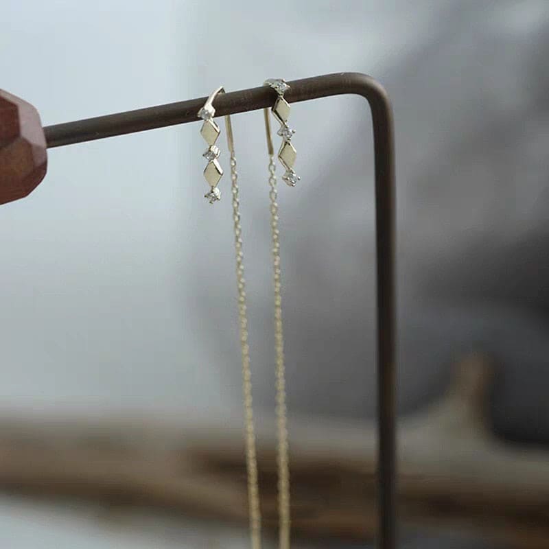 Boucle d&#39;oreille chaine traversante losange doré