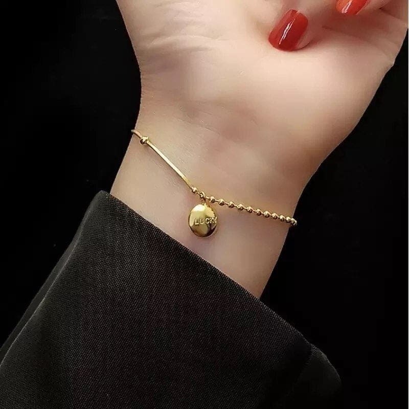 Chaine de cheville or avec boules